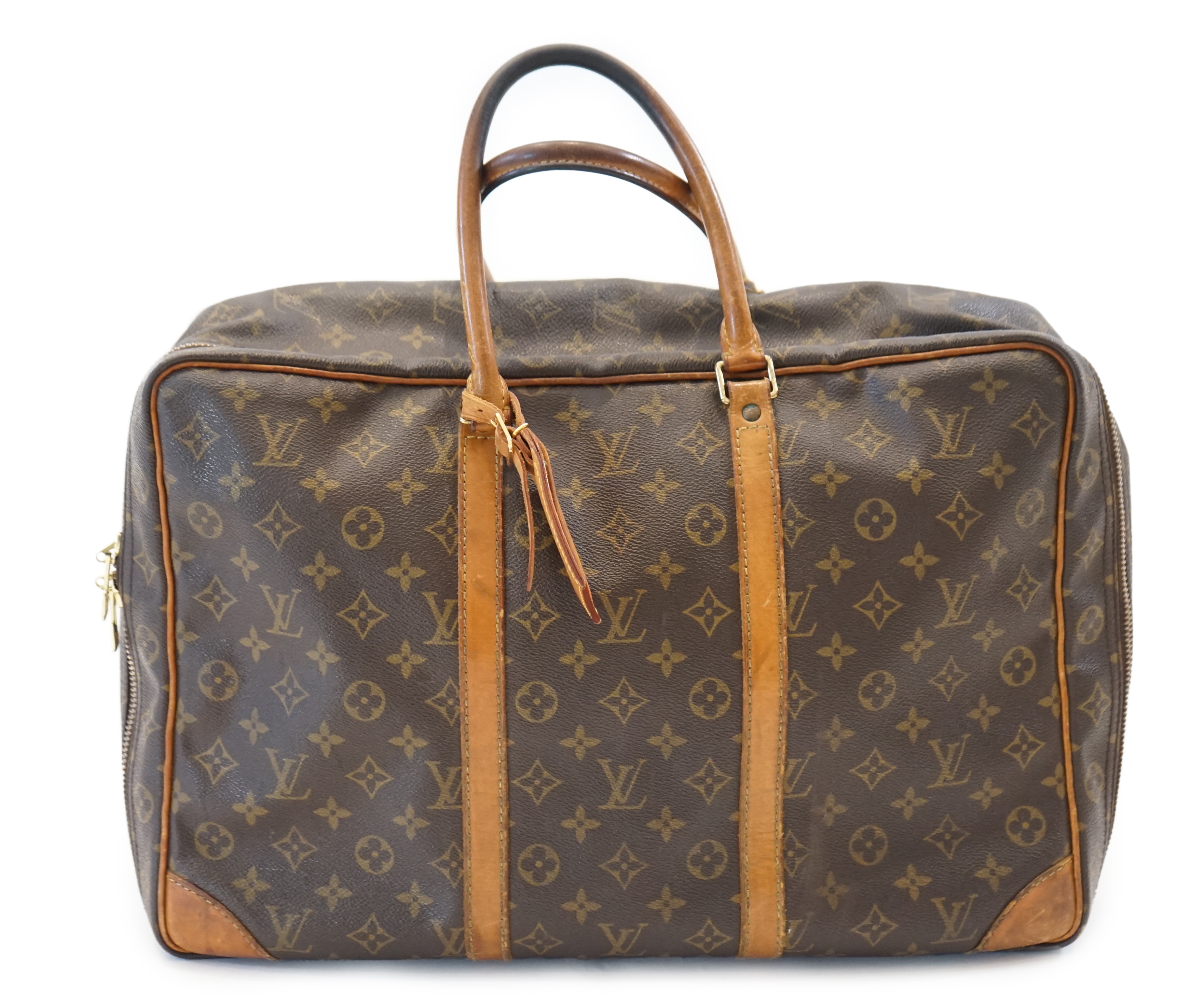 A Louis Vuitton Keepall leather travel bag with luggage tag width 13cm, length 45cm, height 30cm
